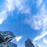 A photo of some buildings and the sky, shot from the ground.